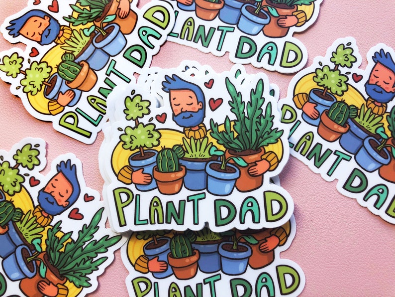 May include: A set of five stickers featuring a cartoon character with a beard and a variety of potted plants. The stickers are all white with a yellow background and the text "Plant Dad" in green and blue letters.