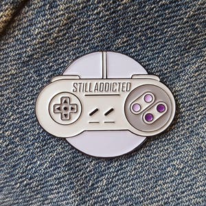 SNES - &#39;Still Addicted&#39; Enamel Pin