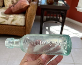 1880's Aqua Colored M. Reddy & Sons 64 Henry St. Jersey City N. J. Embossed Hutch or Hutchinson Soda Bottle