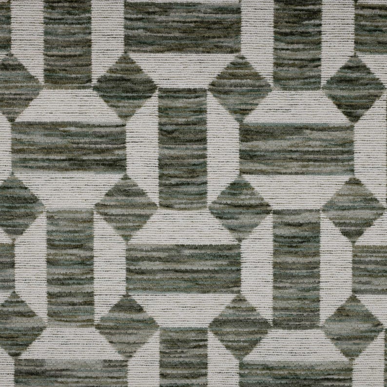 May include: A woven fabric featuring a geometric pattern of dark olive green and grey rectangular blocks interspersed with diamond shapes. The design is defined by crisp white horizontal lines that create a structured grid across the surface.