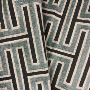 May include: A set of three ceramic mugs with a speckled, matte finish. The mugs are in shades of cream, light gray, and dark gray. Each mug has a simple, minimalist design, perfect for coffee or tea.