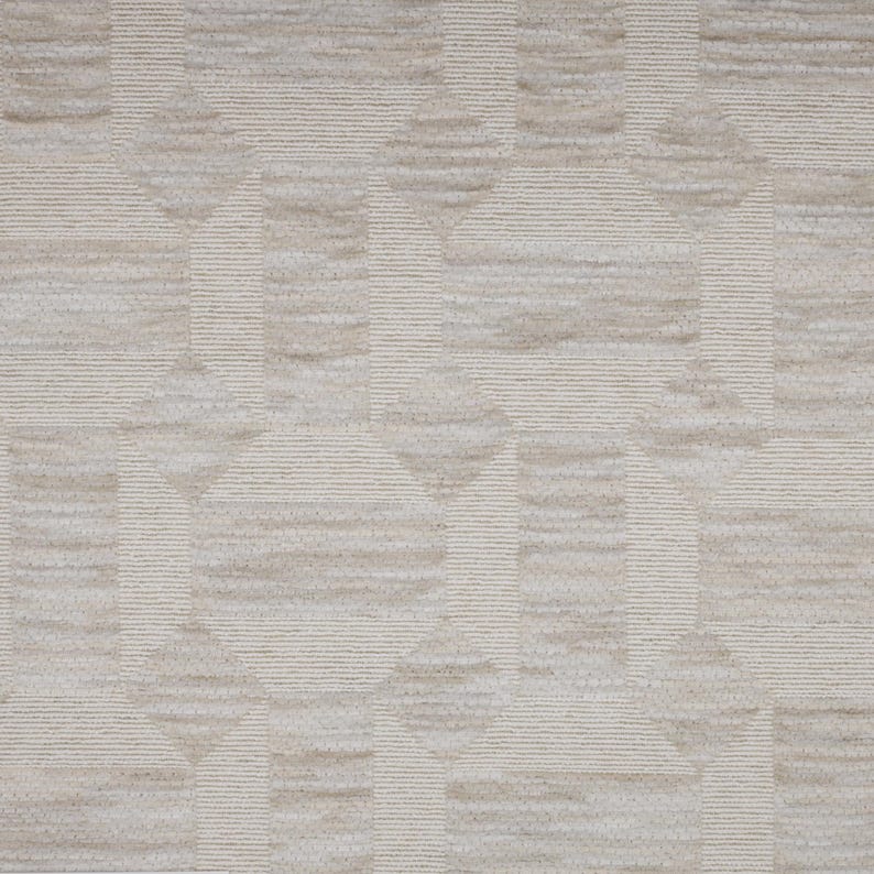 May include: A beige and off-white textile fabric featuring a repeating geometric pattern of circles and squares. The design is composed of alternating textured horizontal lines and smooth solid sections, creating a subtle, tactile, and monochromatic visual effect across the entire surface of the material.