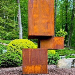 Balanced: Abstract geometric metal sculpture. Modern outdoor decor, yard art.