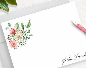 May include: A white card with a floral design in the upper left corner. The card has the name "Jackie French" written in cursive at the bottom.