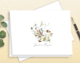 May include: A white card with a floral design in shades of brown, green, yellow, and purple. The name "Jessica Payne" is written in cursive at the bottom of the card.