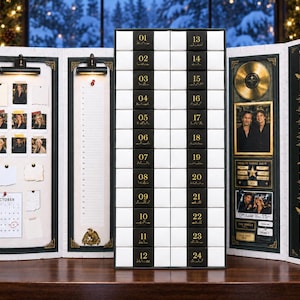 May include: A multi-panel advent calendar featuring a central grid of twenty-four numbered black and white drawers. The side panels display a photo collage, a numbered list, a gold record, a framed portrait, and decorative bird graphics.