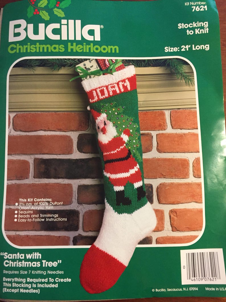 May include: A Bucilla Christmas Heirloom stocking kit to knit a 21-inch long stocking featuring a Santa with a Christmas tree design. The kit includes yarn, sequins, beads, trimmings, and instructions.