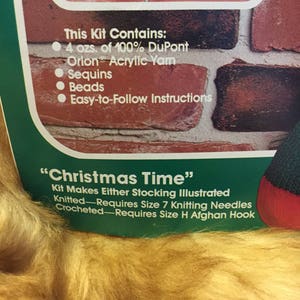 May include: A craft kit for making a Christmas stocking. The kit includes 4 ounces of 100% DuPont Orion acrylic yarn, sequins, beads, and easy-to-follow instructions. The kit makes either a knitted or crocheted stocking. The knitted stocking requires size 7 knitting needles and the crocheted stocking requires size H afghan hook.