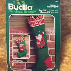 May include: A Bucilla Christmas Heirloom kit for knitting or crocheting a green and red stocking with a Santa Claus design. The kit includes yarn, sequins, beads, and instructions. The stocking is 21 inches long when knitted and 16 inches long when crocheted.