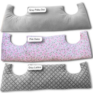 May include: Three patterned pillows are displayed. The top pillow is gray with white polka dots, labelled "Gray Polka Dot." The middle pillow is pink with a floral pattern, labelled "Pink Daisy." The bottom pillow is gray with a lattice pattern, labelled "Gray Lattice."