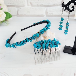 May include: A collection of turquoise gemstone hair accessories, including a headband, a hair comb, and earrings. The headband and comb have a black base decorated with turquoise stones. The earrings are silver with turquoise details. The accessories are displayed on a white surface.