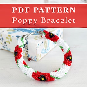 May include: A beaded bracelet featuring a white background with red poppy flower motifs, black centres, and green stems. The text PDF PATTERN Poppy Bracelet is displayed at the top. The bracelet includes a silver-toned metal clasp and chain.