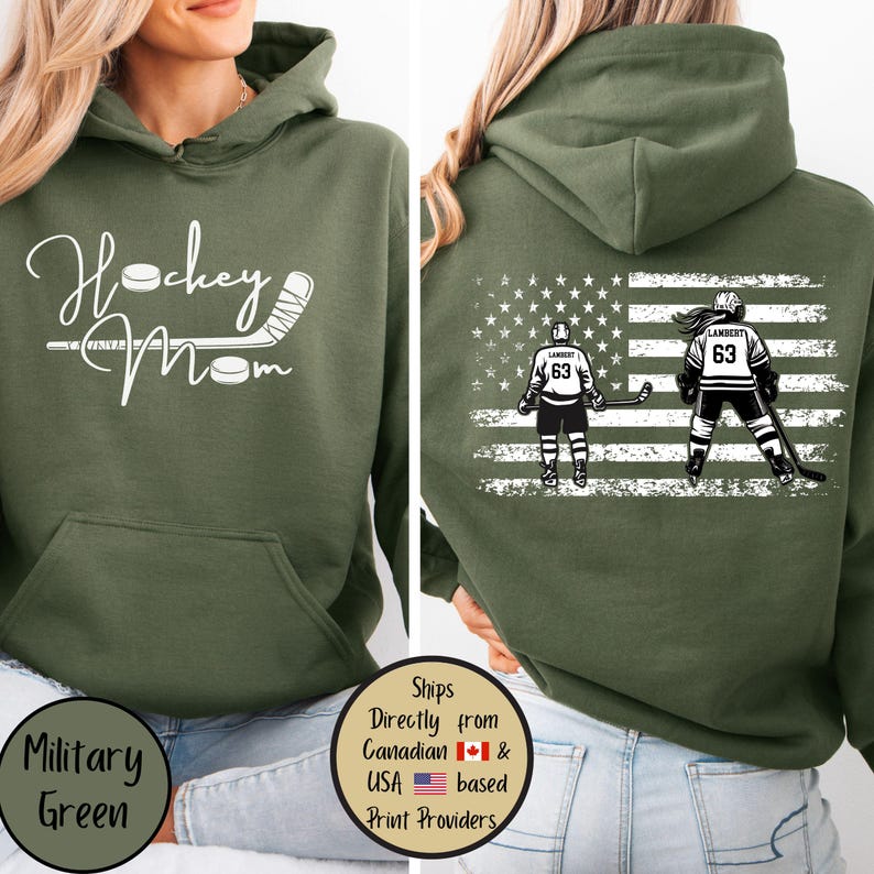 May include: Military green hoodie with the text "Hockey Mom" in white script on the front. The back features an American flag design with two hockey players and the name "Lambert" and the number "63".