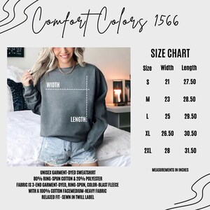 May include: Size chart for a unisex garment-dyed sweatshirt. The chart shows the width and length measurements in inches for sizes S, M, L, XL, and 2XL. The sweatshirt is made of 80% ring-spun cotton and 20% polyester. The fabric is 3-end garment-dyed, ring-spun, color-blast fleece with a 100% cotton face, medium-heavy fabric. The sweatshirt has a relaxed fit and is sewn in a twill label.