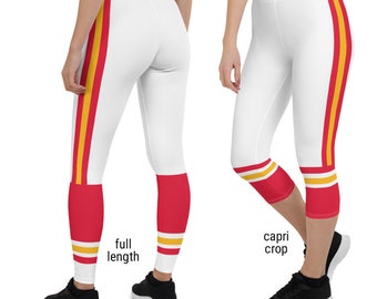 May include: White leggings with red and yellow stripes down the sides. The leggings are available in two lengths: full length and capri crop.