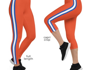 May include: Orange leggings with white and blue stripes down the sides. The leggings are shown in both full length and capri crop styles.  "ORANGE" is written in white text at the top of the image.