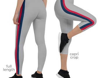 May include: Two pairs of gray leggings with a red, navy blue, and white stripe down the side. One pair is full length and the other is capri length.