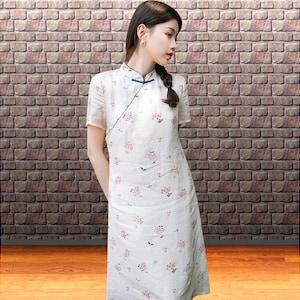 White qipao style dress with pink floral, Mandarin neckline, Green trim, Short sleeves, Chinese inspired modern summer daily wear for women