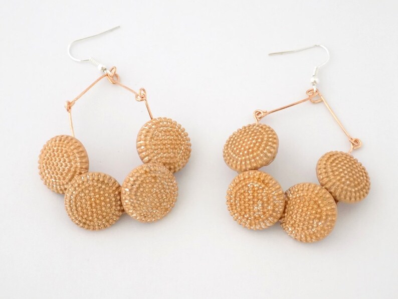 Pink gold rings design buttons with relief points
