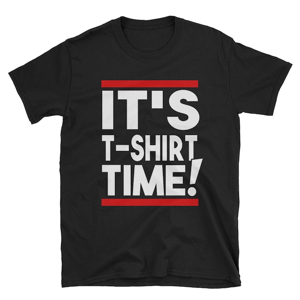 May include: Black t-shirt with white text that reads "IT'S T-SHIRT TIME!" in a bold, blocky font. The text is framed by a red line at the top and bottom.