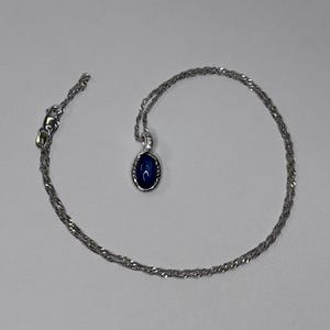 Collar con colgante de zafiro estrella Sky Gazer con topacio blanco, de plata esterlina, de la marca Estate Bradford Exchange.