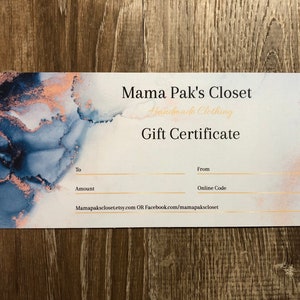 May include: A gift certificate for Mama Pak's Closet, a handmade clothing shop. The certificate has a blue and gold marble design and includes spaces for the recipient's name, the amount of the gift certificate, and the giver's name. The certificate also includes the shop's website and Facebook page.