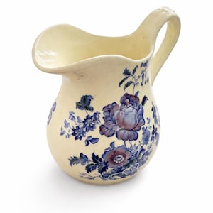 May include: A set of three ceramic mugs with a speckled, matte finish. The mugs are in shades of cream, light gray, and dark gray. Each mug has a simple, minimalist design, perfect for coffee or tea.