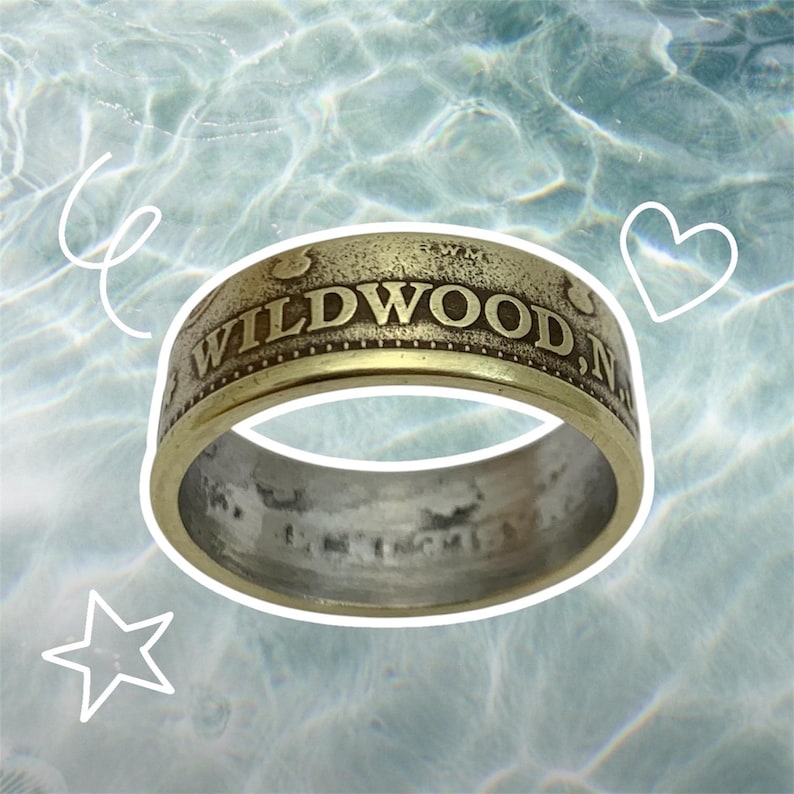 May include: A gold-colored ring with the words "WILDWOOD, NJ" engraved on the band.
