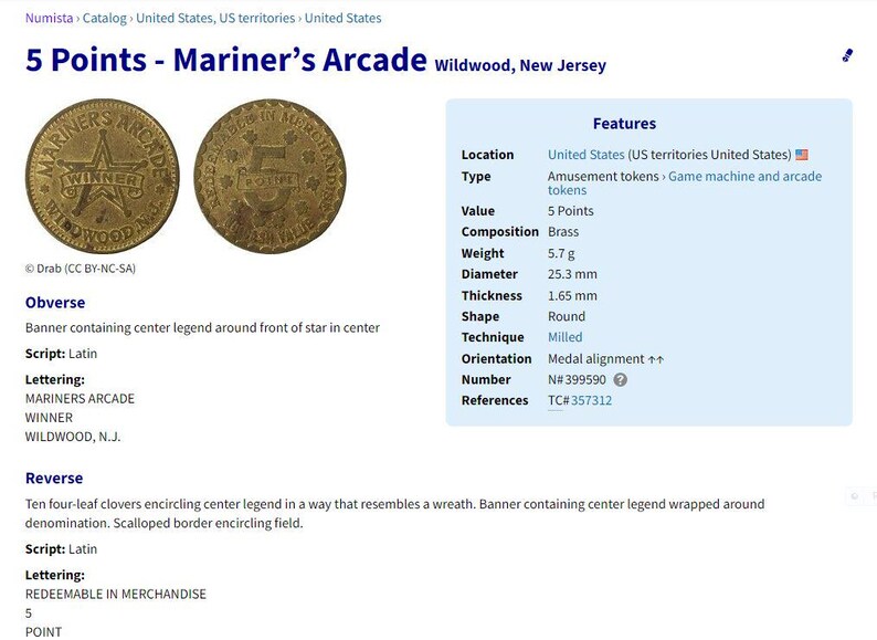 May include: A gold-colored metal token with the inscription "Mariners Arcade Wildwood, N.J." and a star in the center. The reverse side features the inscription "Redeemable in Merchandise 5 Point".