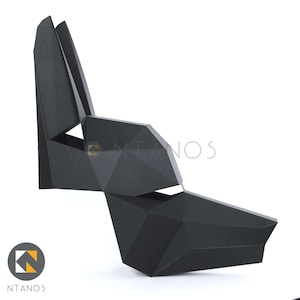 May include: A black geometric sculpture of an animal head, possibly a wolf or dog, with sharp angles and a modern design. The sculpture is made of a matte black material and is set against a white background.