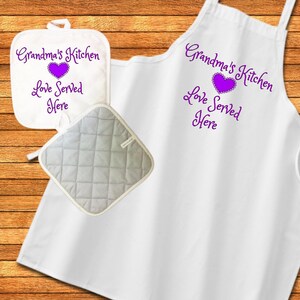 May include: White kitchen apron and pot holder set with purple embroidery that reads "Grandma's Kitchen Love Served Here" and a purple heart.