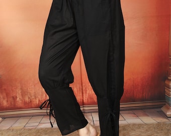 Black Viking Inspired Gender Free Elasticated Cotton Free Size Trouser With Lace Up Details On The Calfs