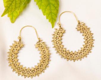 Boho Mandala Brass earrings with delicate cutout patterns | Tribal-inspired crescent hoops with intricate geometric motifs