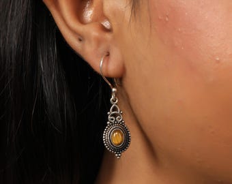 Ethnic Oval Cabochon Drop Earrings | Ornamental Scrollwork Brass Dangles | Serrated Dot Frame Design | Bohemian Artisan Jewelry