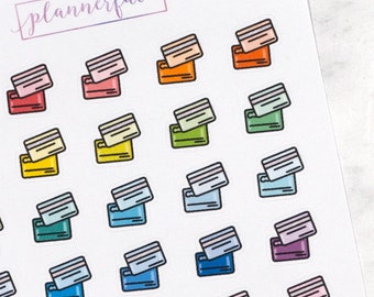 May include: A sheet of colorful credit card stickers with a variety of colors including red, orange, yellow, green, blue, purple, and pink. The stickers are arranged in a grid pattern and feature a simple illustration of a credit card.