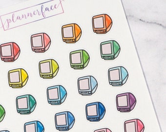 May include: A sheet of colorful computer monitor stickers with the text "plannerface" and "D252". The stickers are in various colors, including pink, blue, green, yellow, and orange.
