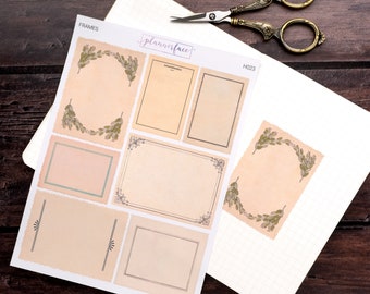 May include: A sheet of planner stickers with various frames and borders. The stickers are on a white background with a grid pattern. The stickers feature a variety of frames, including a wreath, a rectangle with a decorative border, and a simple rectangle. The text "plannerface" and "H023" are visible on the sheet.