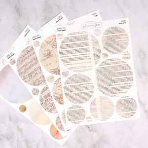 Peut inclure: Quatre feuilles de papier washi décoratif avec des motifs circulaires. Les motifs comprennent des partitions musicales, une carte, des imprimés de livres et des motifs d'aquarelle. Le texte "CIRCLES washi paper" est visible sur les feuilles. Le texte "plannerface" est également visible.