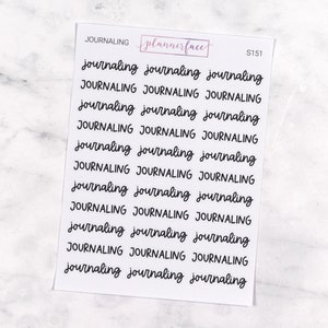 May include: A white sticker sheet featuring the word "journaling" in a black, cursive font, repeated multiple times. The top of the sheet has the word "JOURNALING", the "plannerface" logo in a pink box, and the code "S151".