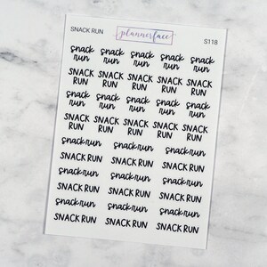 May include: A sheet of clear planner stickers with the text "Snack Run" repeated in various sizes and styles. The text is in black and the background is clear.