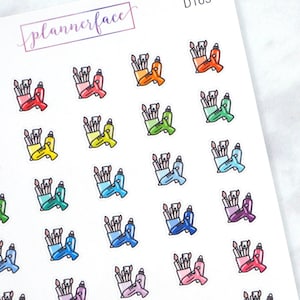 Può includere: Un foglio di adesivi colorati con un motivo ripetitivo di pennelli e bottiglie di colla in una tazza. Gli adesivi sono perfetti per aggiungere un tocco di creatività a planner, diari e altri progetti di artigianato.