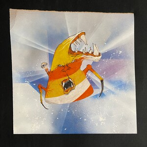 May include: A colorful, abstract creature with a large mouth and multiple eyes. The creature is painted in shades of yellow, orange, red, and white. The background is a light blue with white splatter paint.