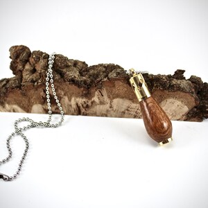 Gold aromatherapy necklace in leopard wood