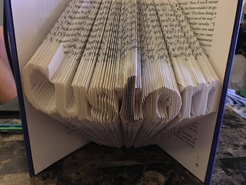 Folded book art from Etsy