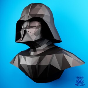 May include: A black and gray origami sculpture of Darth Vader from Star Wars. The sculpture is made of paper and is in the shape of Darth Vader's head and shoulders.