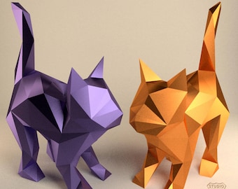 May include: Two origami cats, one purple and one orange, standing on a white surface. The cats are made of paper and have a geometric design.