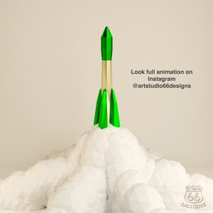 Könnte beinhalten: Eine grüne und goldene Rakete, die von einer weißen wolkenartigen Oberfläche abhebt. Der Text "Look full animation on Instagram @artstudio66designs" befindet sich in der oberen rechten Ecke des Bildes.