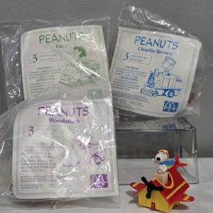 Vintage 1989 McDonalds Peanuts Racers: Charlie Brown, Lucy, Woodstock and Snoopy