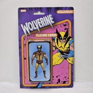 May include: Wolverine playing cards in a retro-style package. The package is purple and pink with the Marvel and Aquarius logos. The card deck features a Wolverine action figure and a comic book illustration of Wolverine.