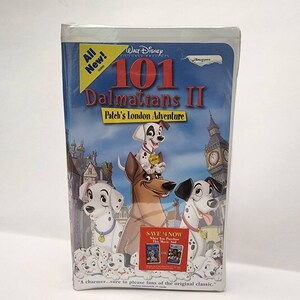 May include: A VHS tape case for the movie "101 Dalmatians II: Patch's London Adventure". The case features a colorful image of the dalmatian puppies and the main character, Patch, in front of a London cityscape. The text "All New!" is in a yellow box in the upper left corner. The text "Save $4 Now" is in a red box in the lower right corner.